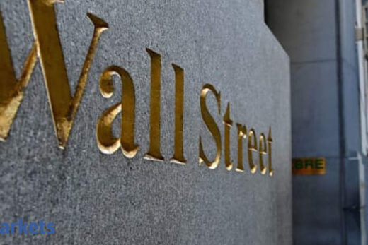 Wall Street hovers near record highs after Biden bounce