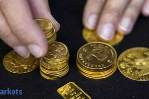 Gold eases as dollar climbs on strong US data