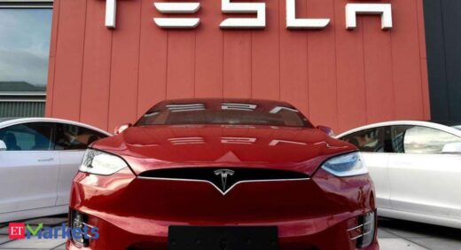 Tesla shares rise in busy trade ahead of S&P 500 debut